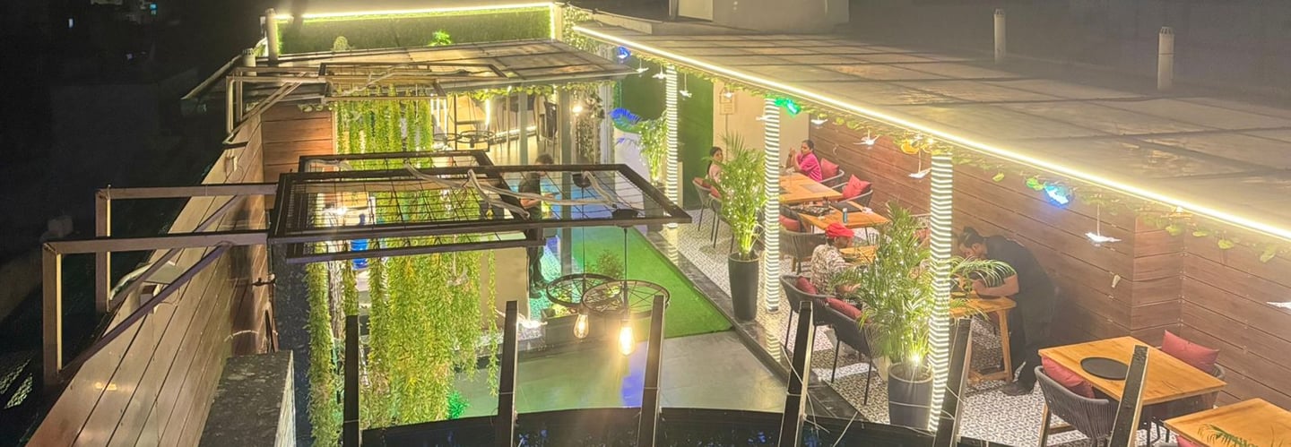 a rooftop bar with a view of a rooftop