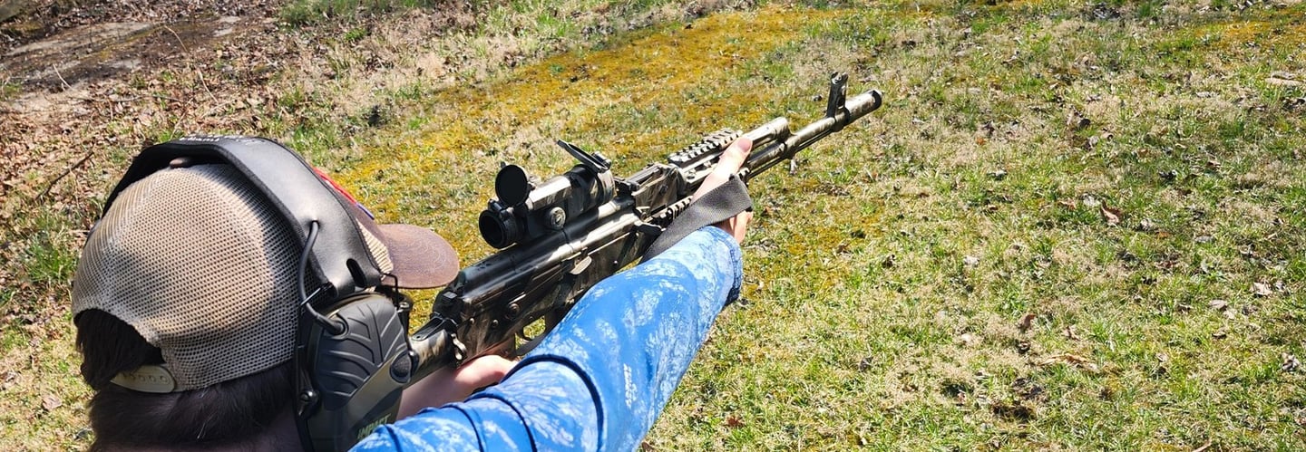 Man using self-defense firearm on range.