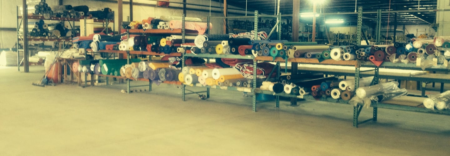 tote bag fabric nterior of a textile manufacturing facility with rolls of American-made fabric