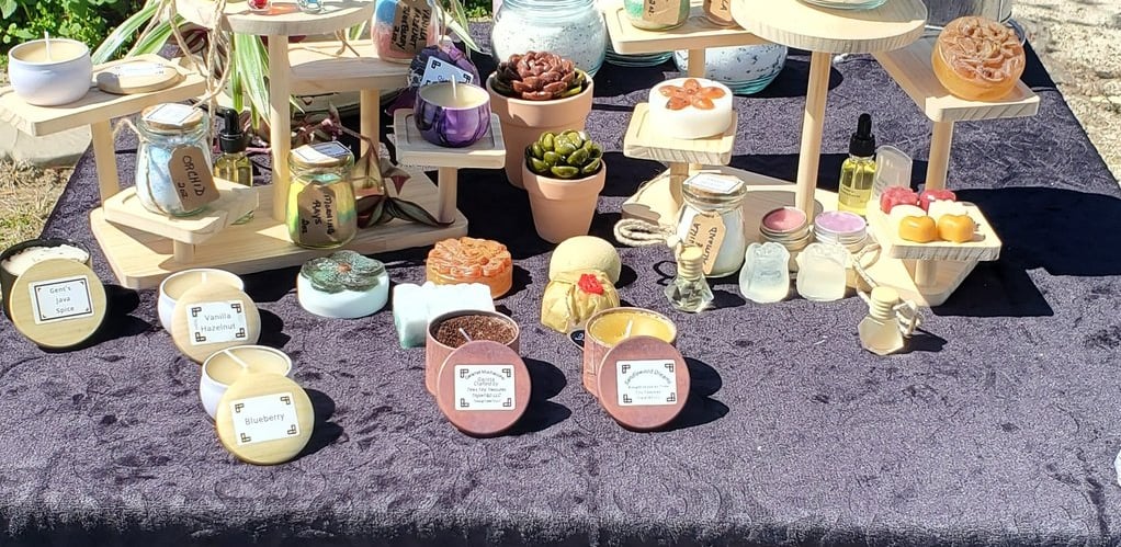 Handmade Organic Beeswax candles, artisan soaps, and oil diffusers on display