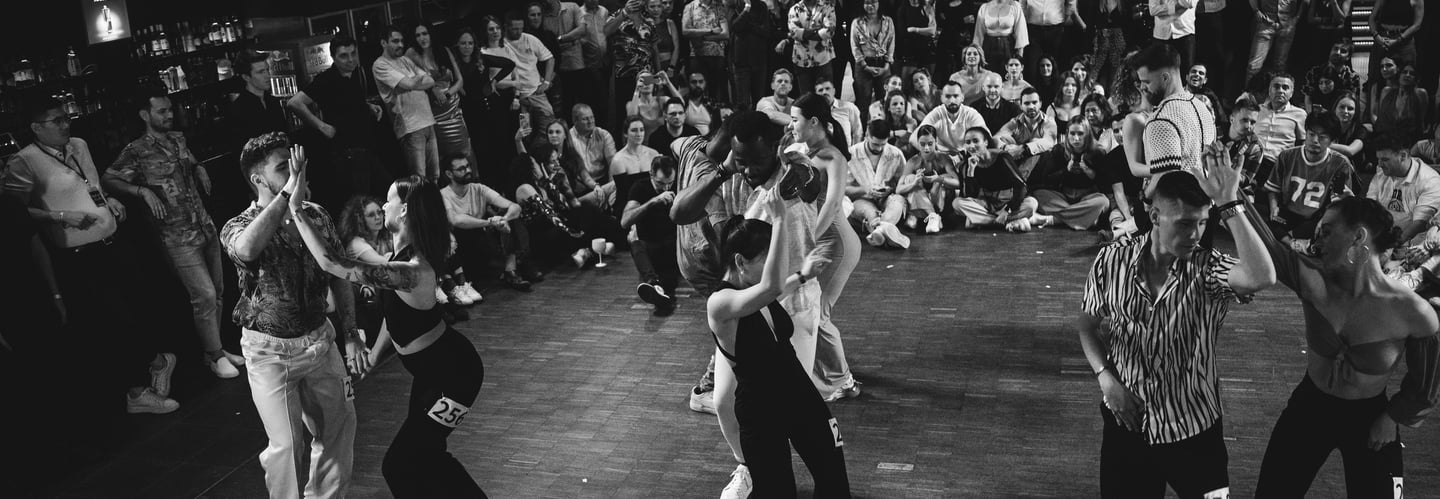 a group of people dancing in a dance floor