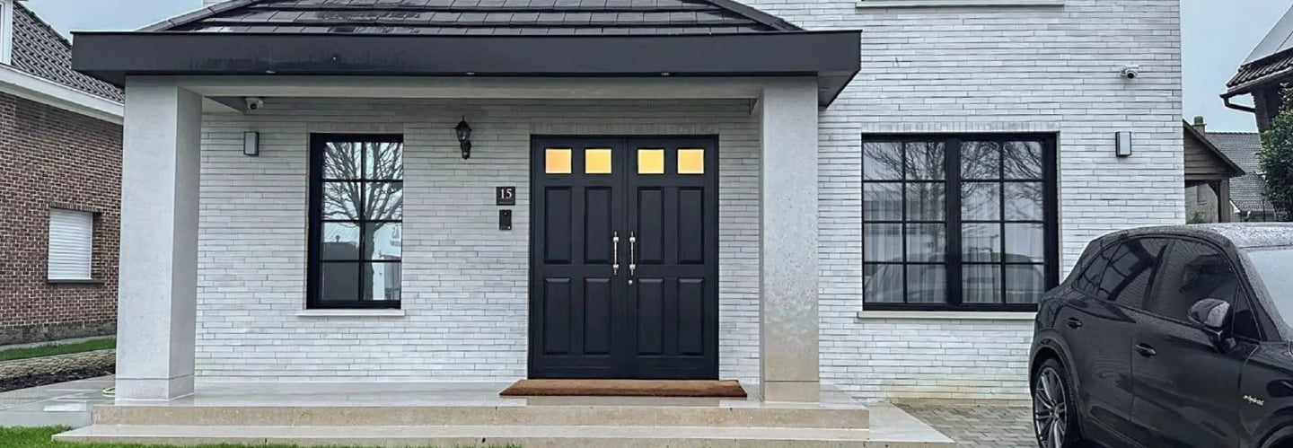wood door and black wood window frames