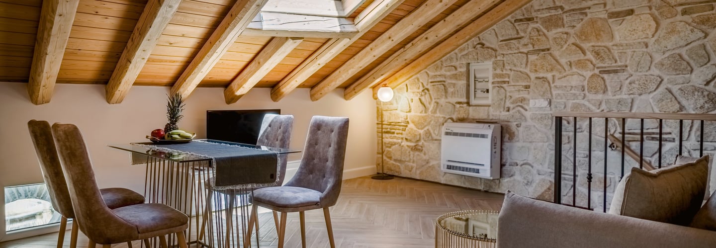 Sophisticated loft accommodation featuring wooden ceiling, natural stone architecture and comfort,