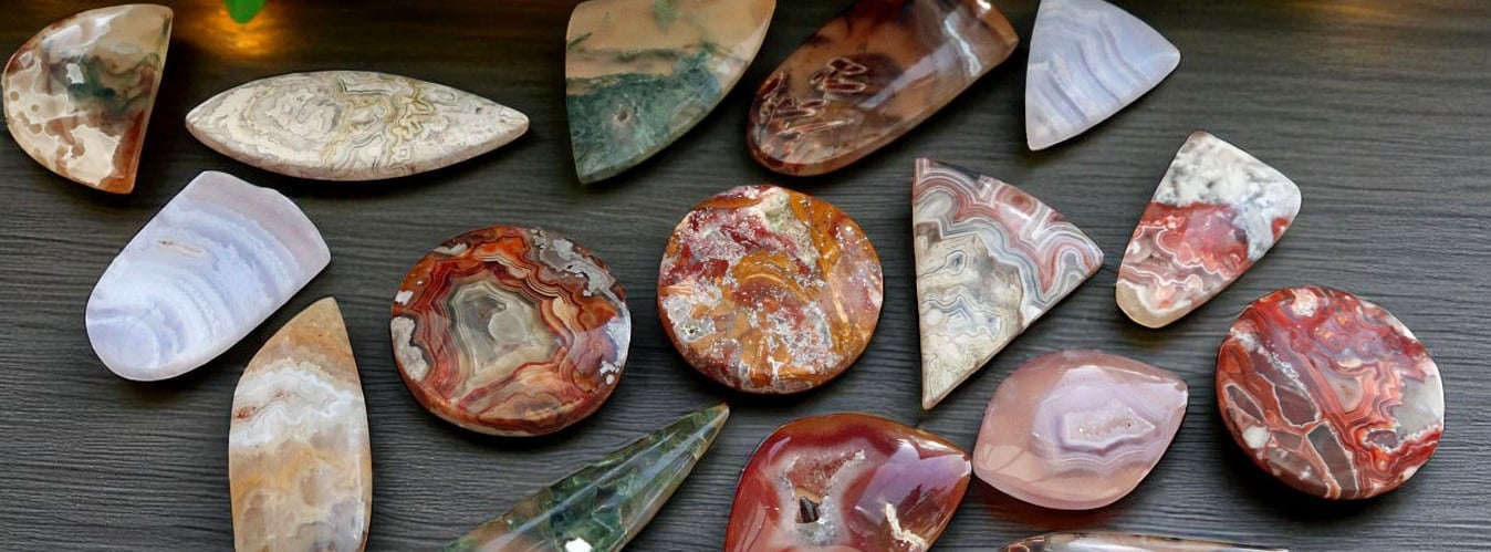 A selection of agate stone cabochons in various cuts with a bright polish 