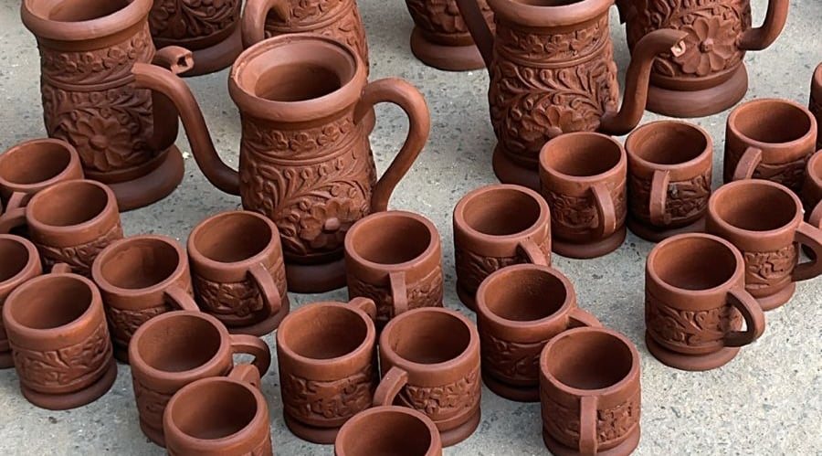 a bunch of wooden pots with a look of clay pots
