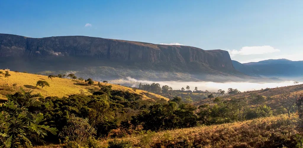 a mountain view of a valley with a valley in the background