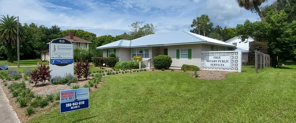 a house with a sign that says,"New York Avenue Insurance"