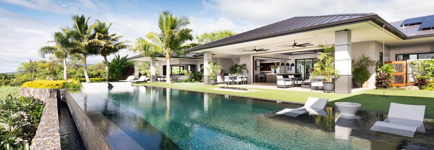 a pool with a view of a house