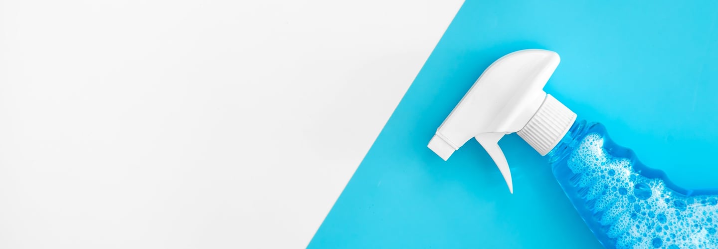 a spray bottle with a spray bottle on a blue and white background