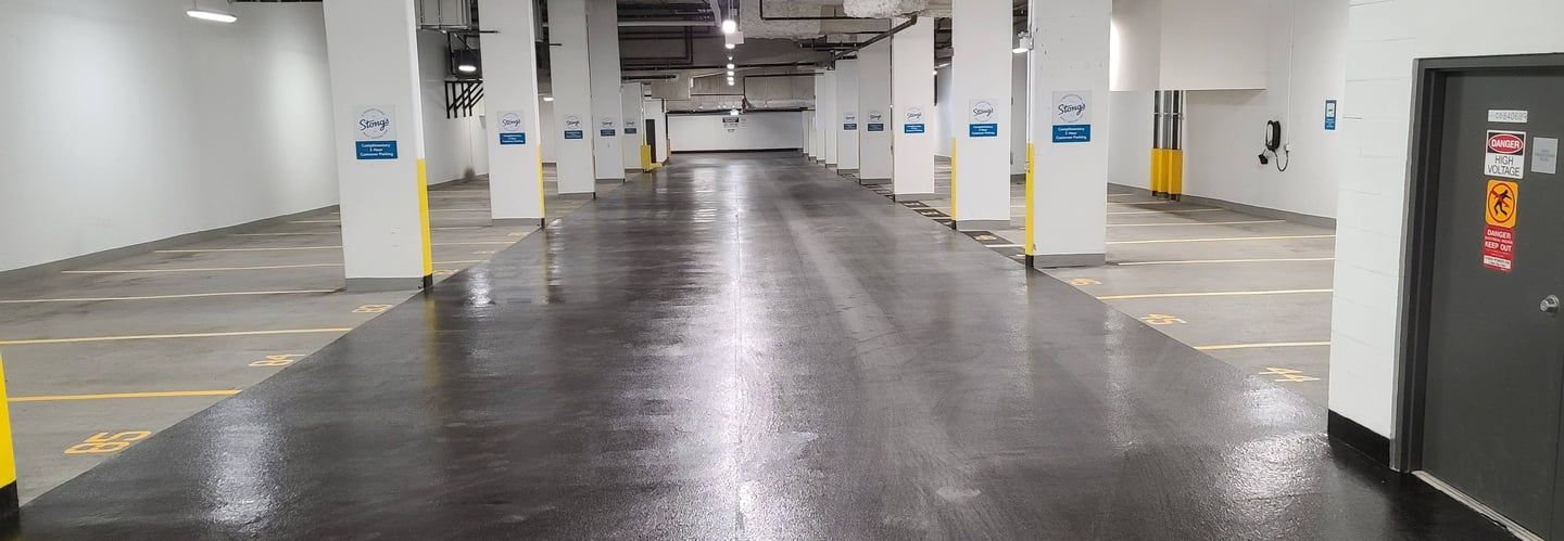 A basement parking lot with a fresh coating applied.