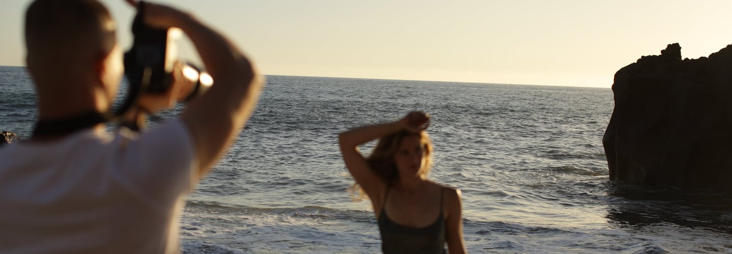 Photographer Mihail Zhelezniak photographing on Praia Formosa Beach