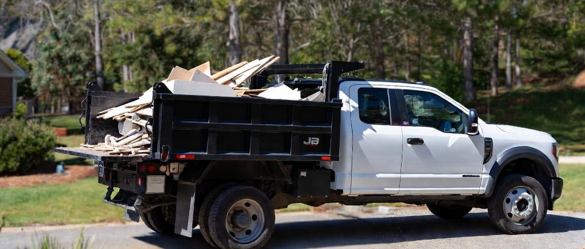 2024 Ford F-550 high side dump truck parked in a clean suburban driveway in Fredericksburg, Virginia