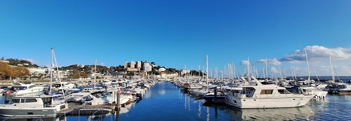 Torquay Marina with boats in azure blue water