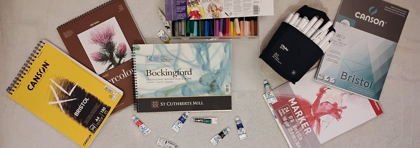 An image of different types of art paper and mediums