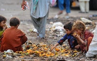 a group of children eating fruit from a pile of fruit