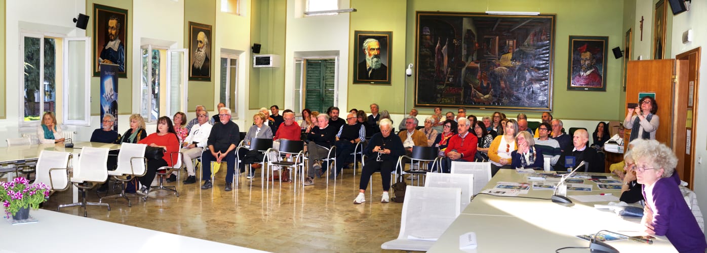 a group of people sitting at tables in a room