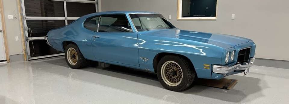 Classic car parked on finished epoxy garage floor installed by Premium Garage Floors