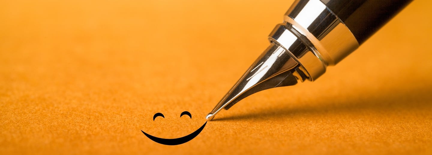 a pen with a smiley face drawn on it