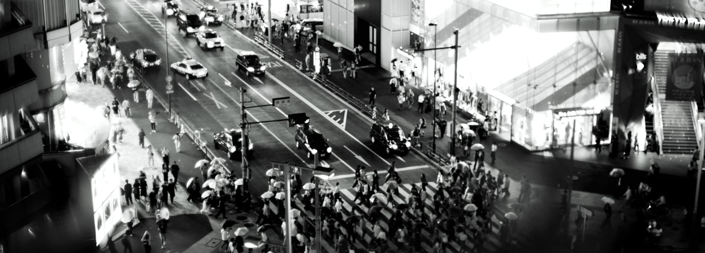 a city street scene with a busy intersection