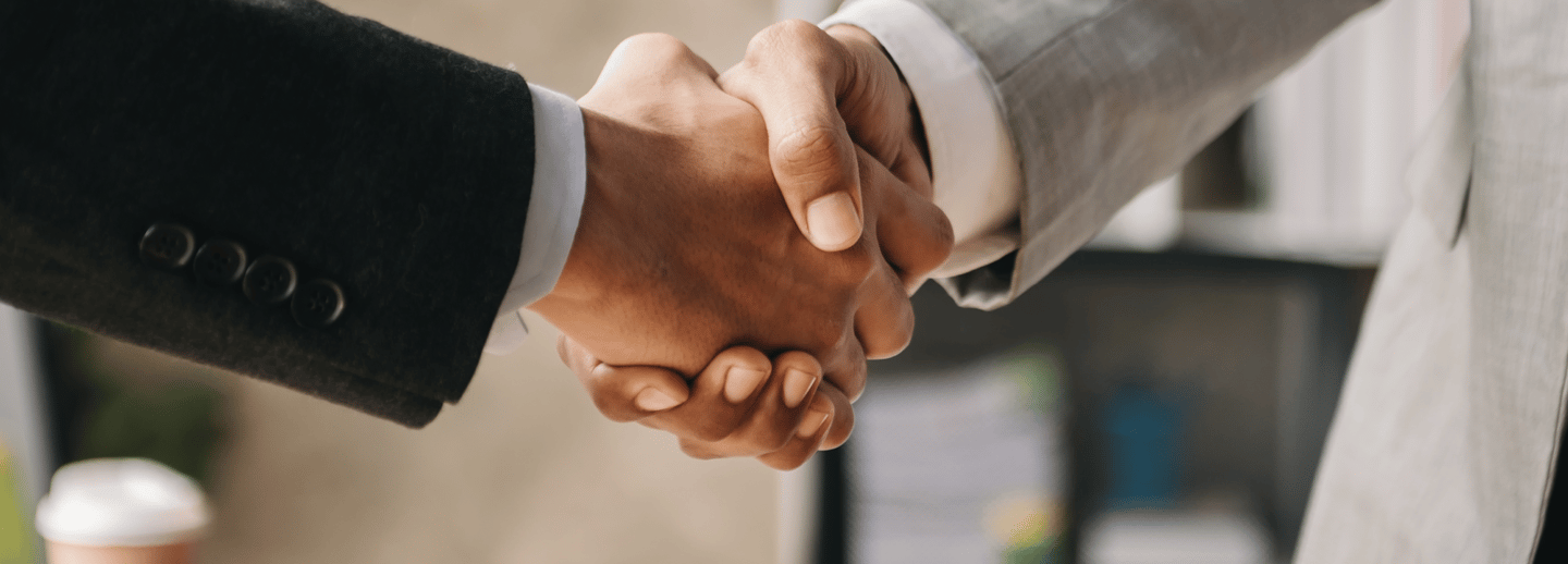 Executives are shaking hands