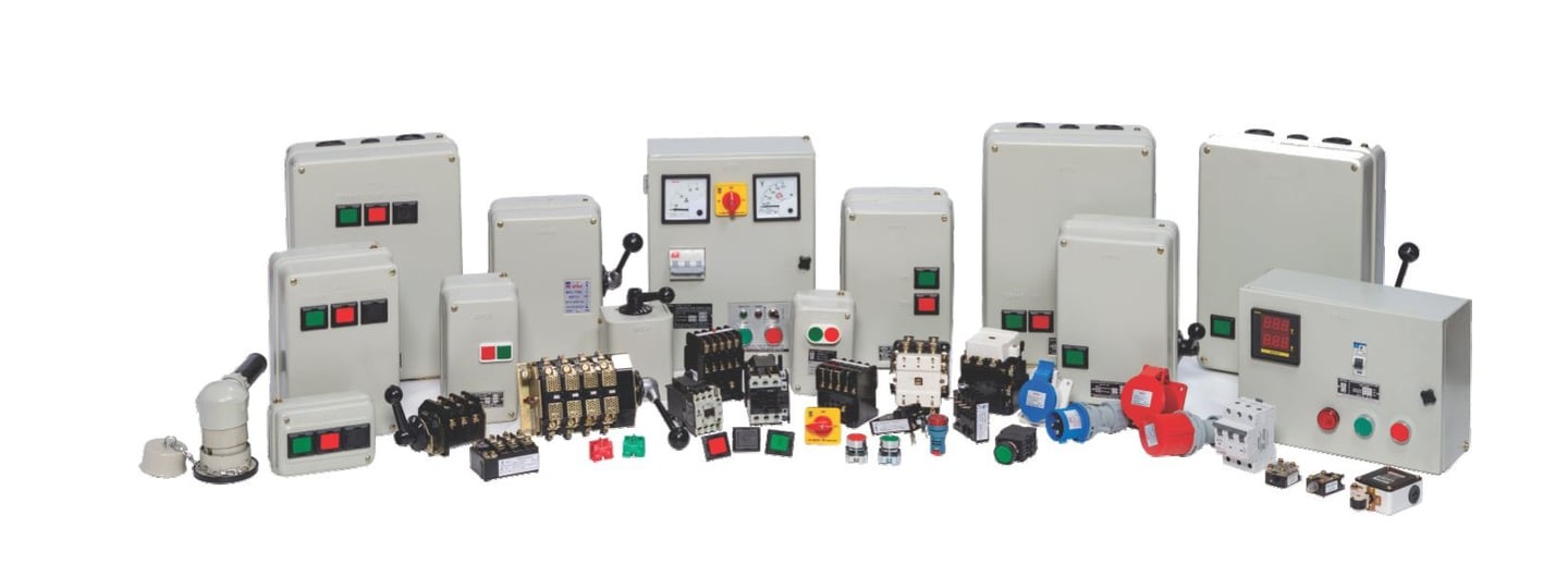 A collection of industrial electrical control panels, switches, and power distribution components.