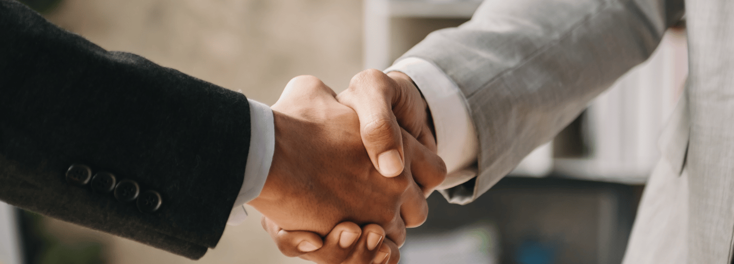 Executives are shaking hands