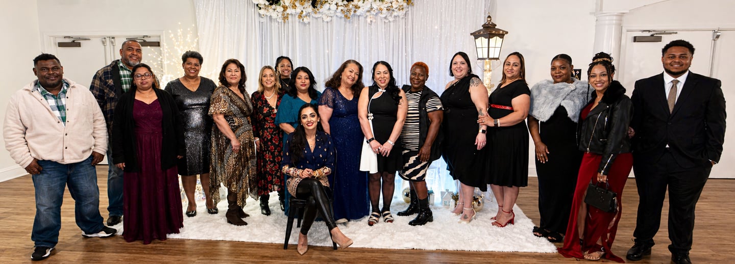Premier Comfort Care team gathered at a formal event, showcasing unity, professionalism, and a family-centered culture