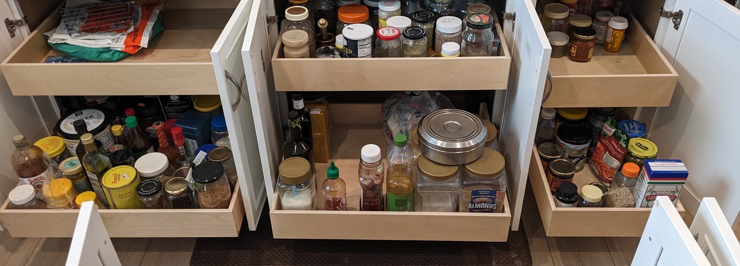 Base cabinet pull outs loaded with contents that are easily accessible.