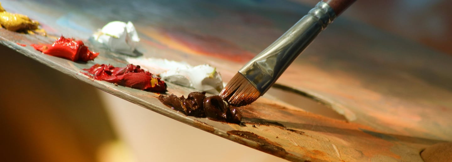 Art palette with brush at EVO Space, creative gallery in Johns Creek