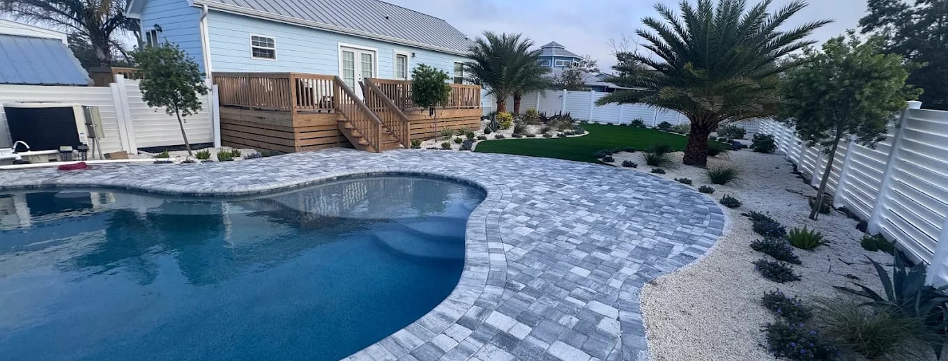 a pool with a deck and a deck with a deck