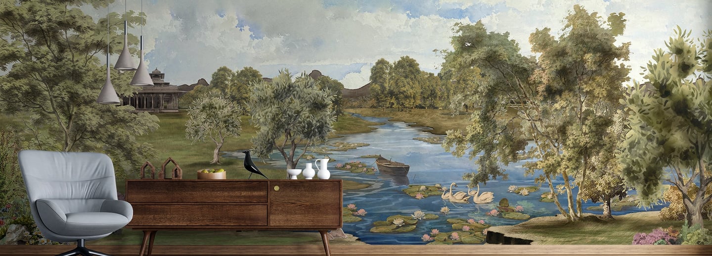 Vintage landscape mural featuring a river with swans behind a mid-century modern sideboard and armchair.