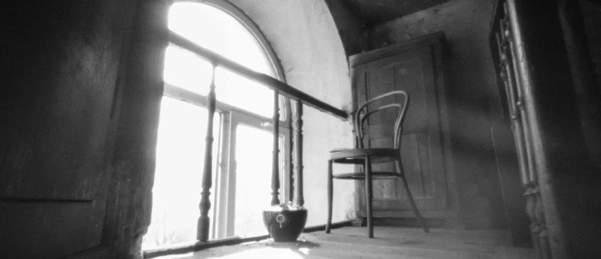 Sunlight-filled space with chair and window