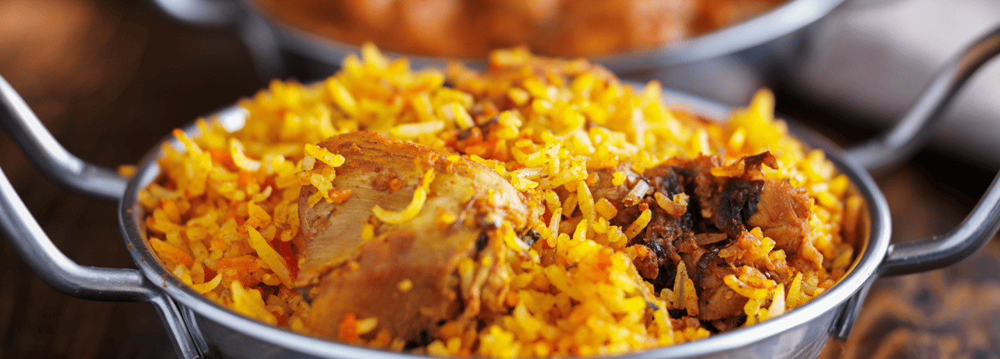 a bowl of food with a chicken and rice rice