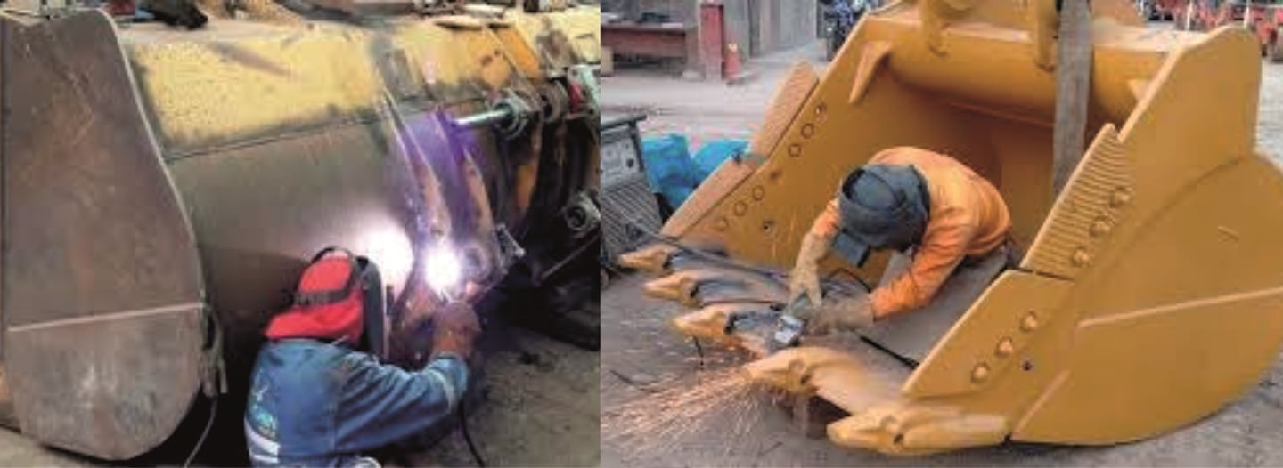 Professional welders performing heavy equipment repair and metal fabrication on industrial excavator buckets.