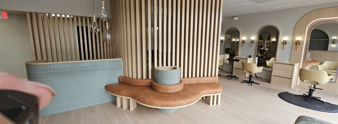 Modern Luxurious Hair Saloon In Boca Raton featuring custom handle less cabinetry 