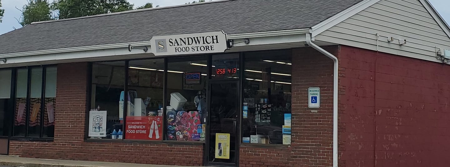 exterior of the convenience store building and part of the parking area