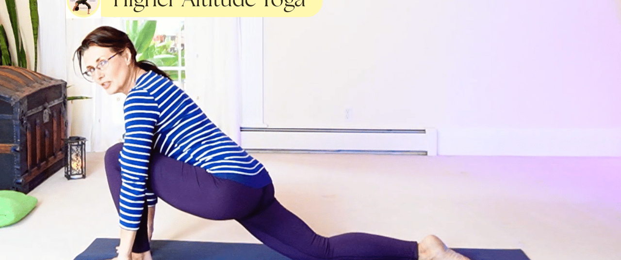 A woman practices a low lunge yoga pose on a blue mat at Higher Altitude Yoga