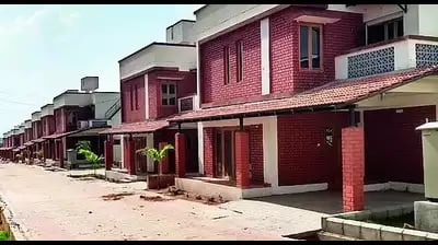 a row of houses with red brick walls and white trim