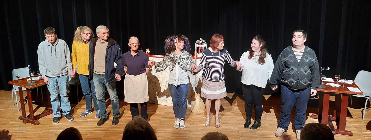 a group of people standing on a stage