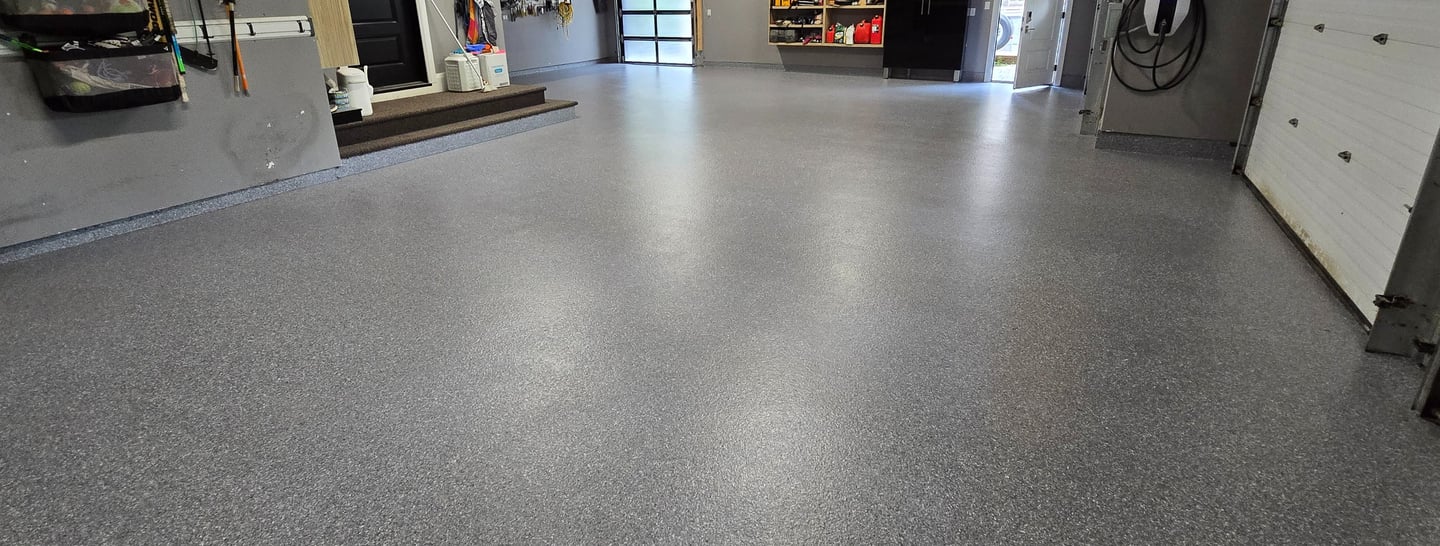 MMA garage flooring with decorative flake finish and radius cove base