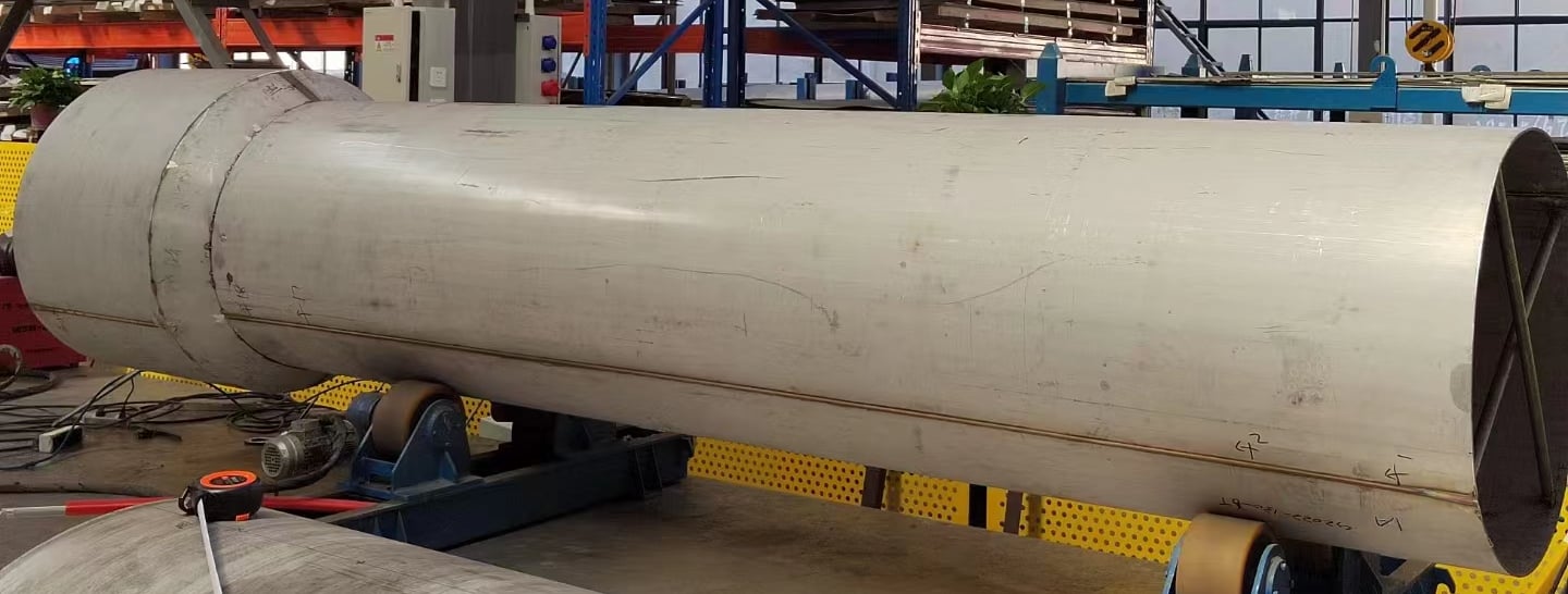 PMI Piping large welded pipes in workshop