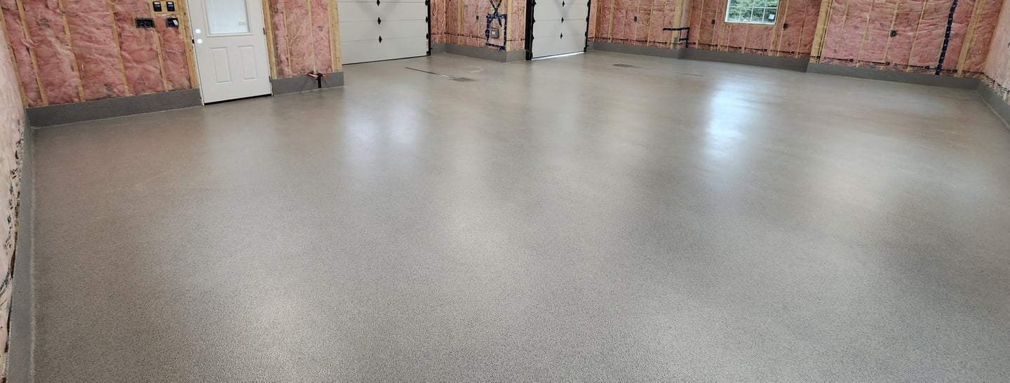 MMA quartz garage floor with smooth finish and radius cove base