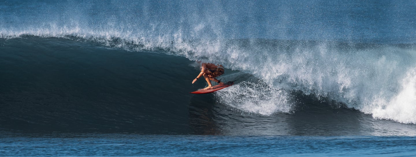 a person riding a surfboard in the ocean