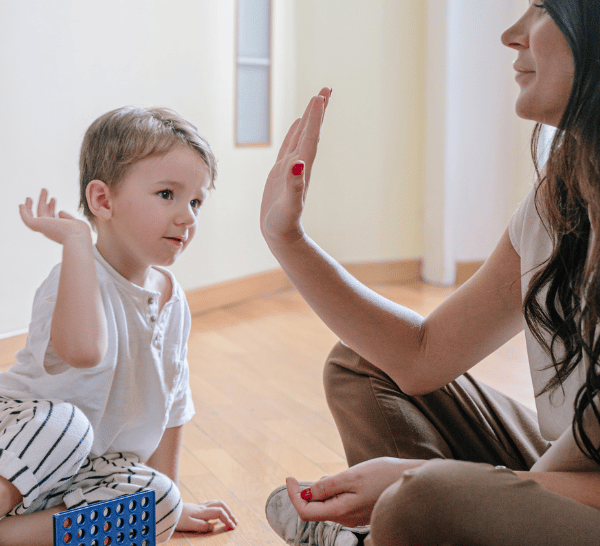 a mother doing hi fi with baby