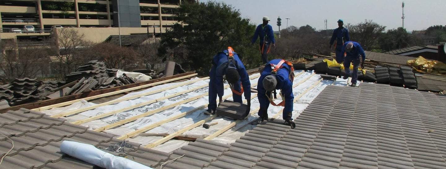Laying roof tiles for roof installation Project, Environmental Pro Construction