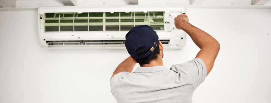 Technician performing AC maintenance as part of Coolline’s AC Repair Service in Greater Noida.