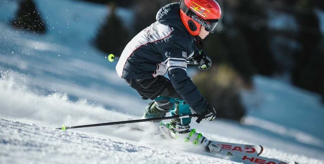 a person skiing down a snowy slope
