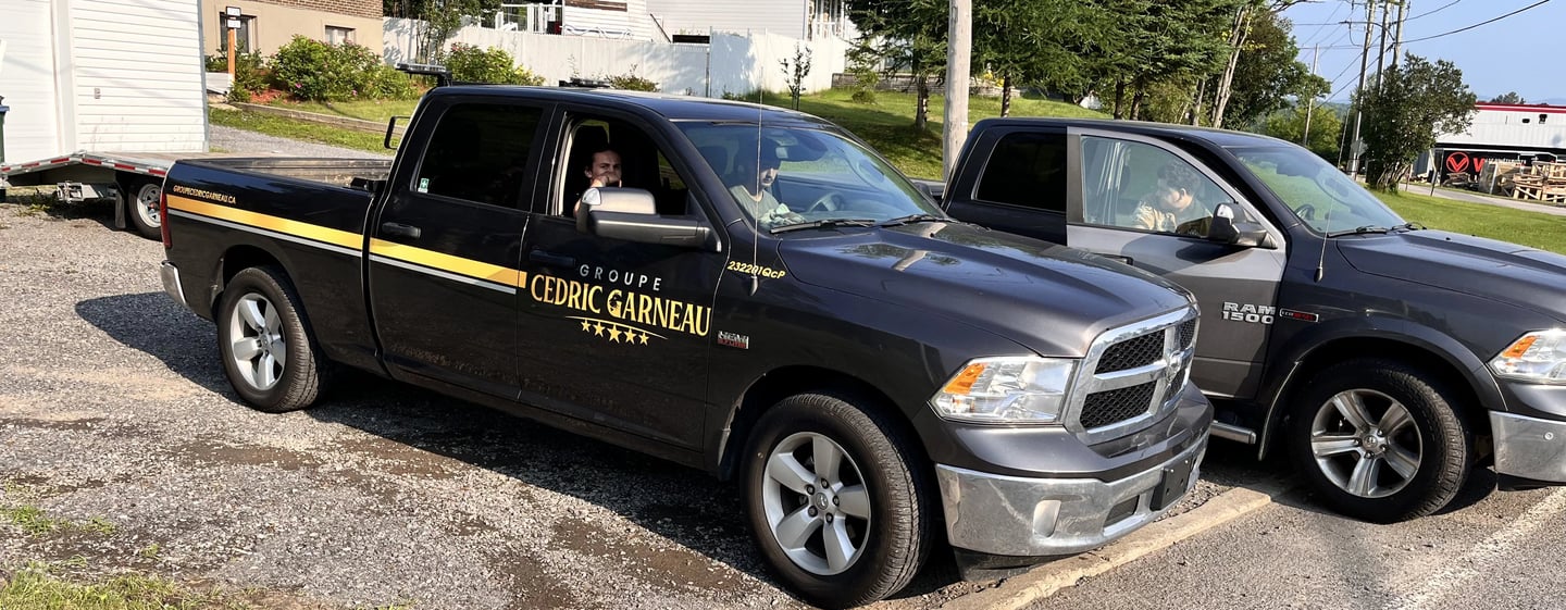 2 company trucks with employees