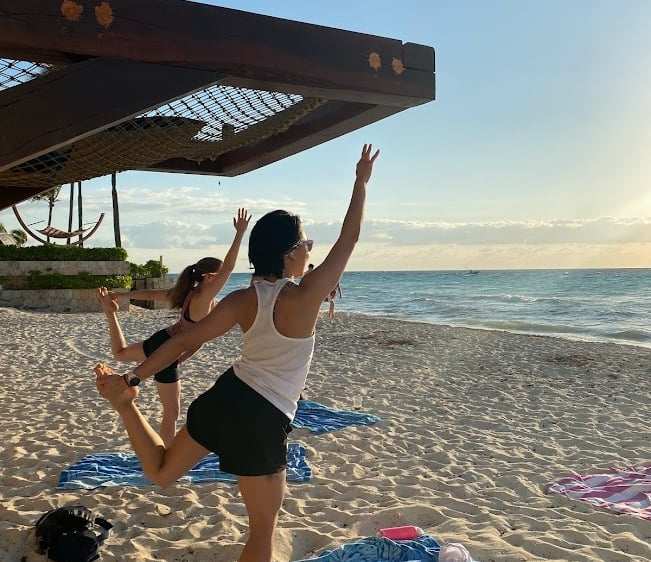 doing yoga on the beach in Playa del Carmen
