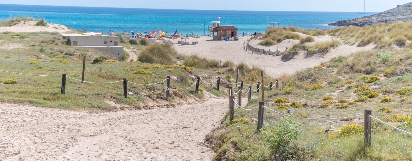 Sandy walkway to Cala Mesquida beach
